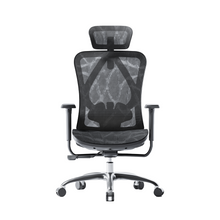 Load image into Gallery viewer, A black mesh ergonomic office chair with a five-point wheeled base and armrests.
